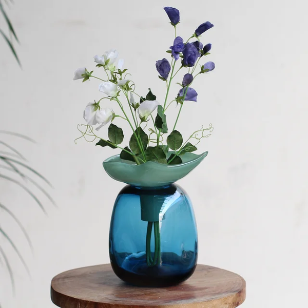 Dented vase with leaf lid