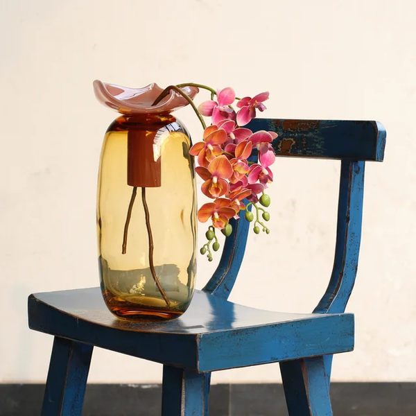 Dented vase with leaf lid